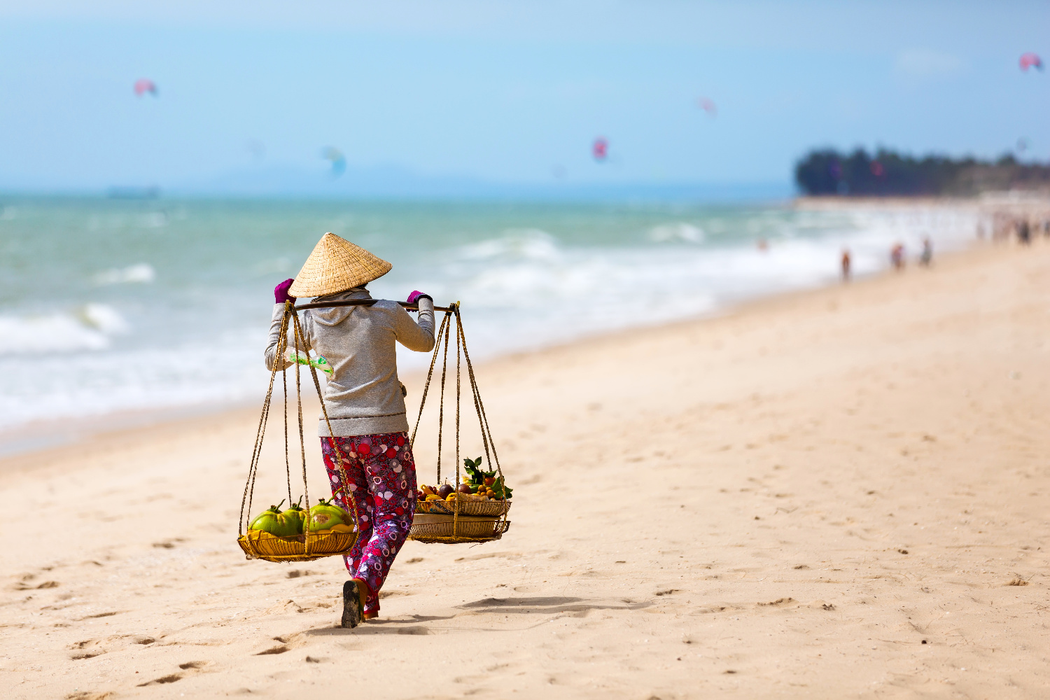 Vietnamese woman selling Fruits at Mui Ne beach. Vietnam